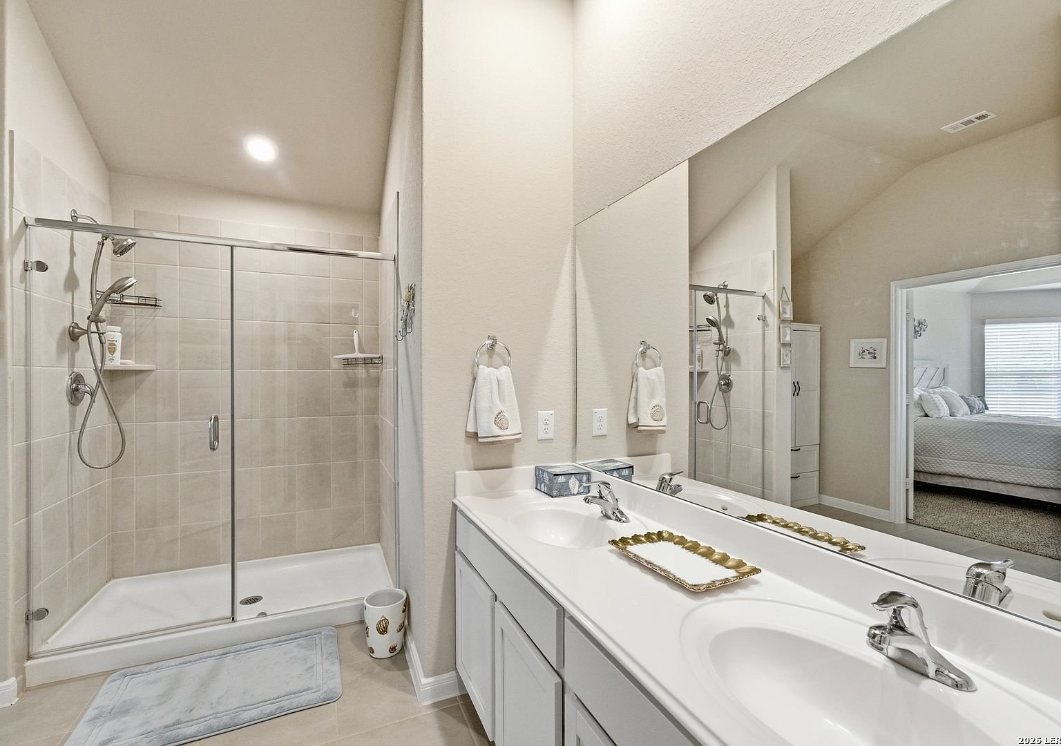 Primary bath with walk-in shower and double vanity