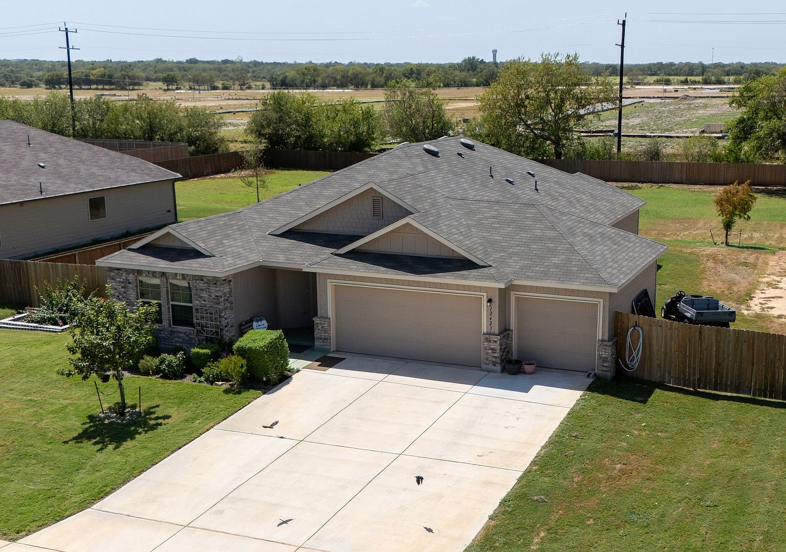 Aerial view of the front and driveway